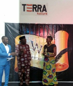 Performance Poet, Iquo Diana Eke, receiving the award on my behalf